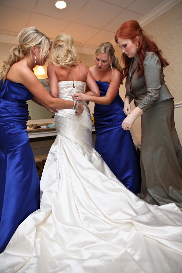 brides dress and blue bridesmaids dresses